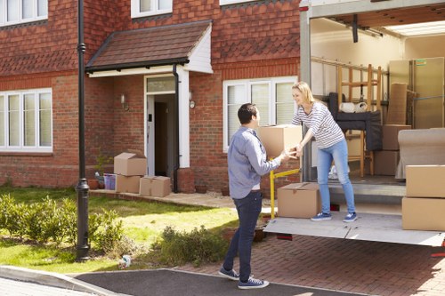 Moving boxes and removal van prepared for house removals in Harlington