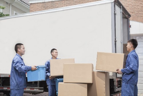 Removal team loading items during a Harlington home move