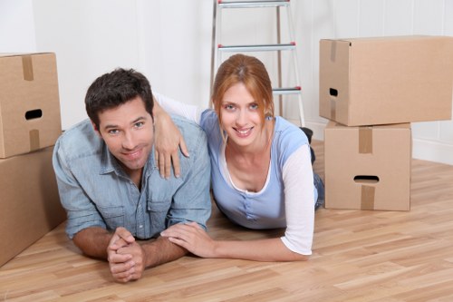Organised storage unit in Harlington with boxes and furniture
