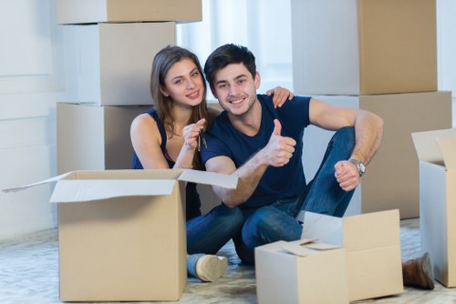 Professional moving team loading furniture for a Harlington relocation